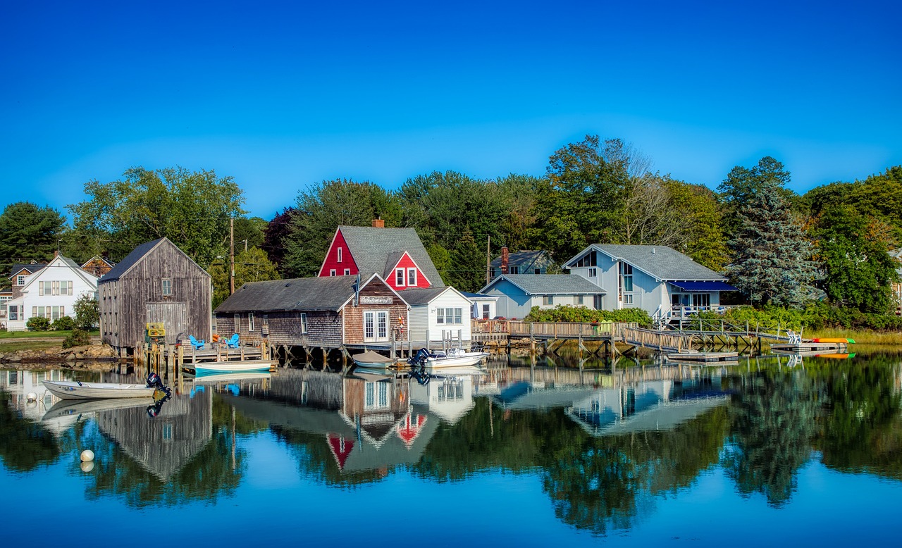 lakeside floating homes/sheds, recreational boats in the water