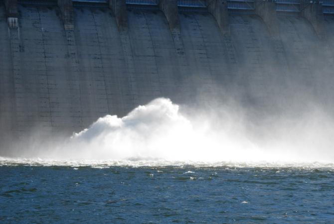 water off a concrete dam wall