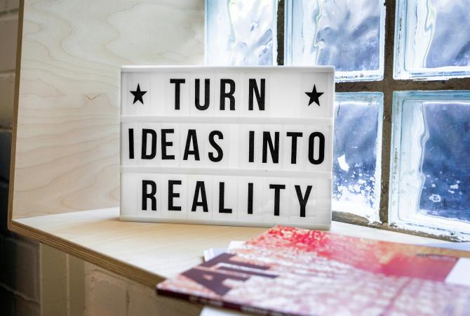 sign in a window that reads Turn ideas into reality